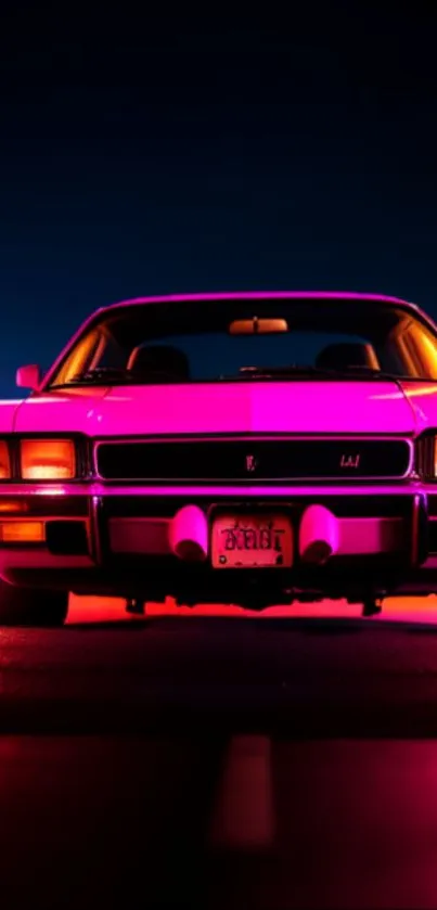 Neon-pink illuminated car on a city street at night, exuding vintage charm.