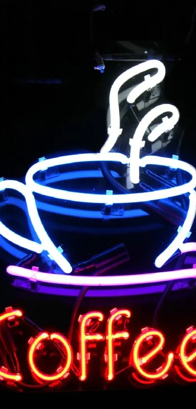 Neon coffee cup sign with vibrant colors on a black background.