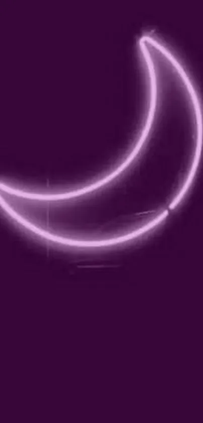 Purple neon crescent moon over dark background.