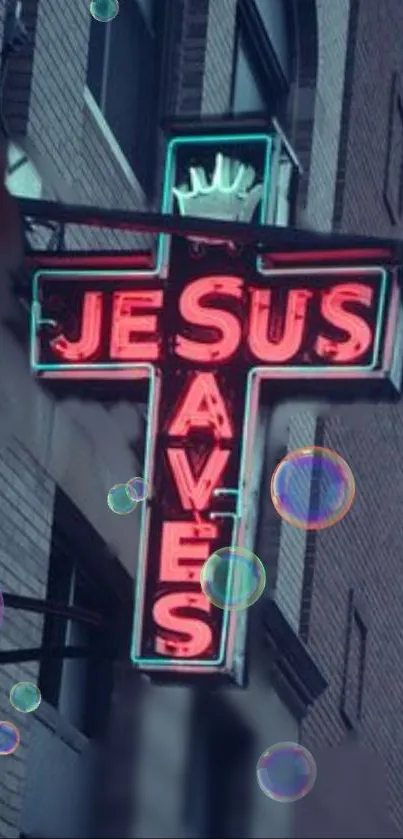 Neon cross sign reading 'Jesus Saves' with bubbles on a city wall.