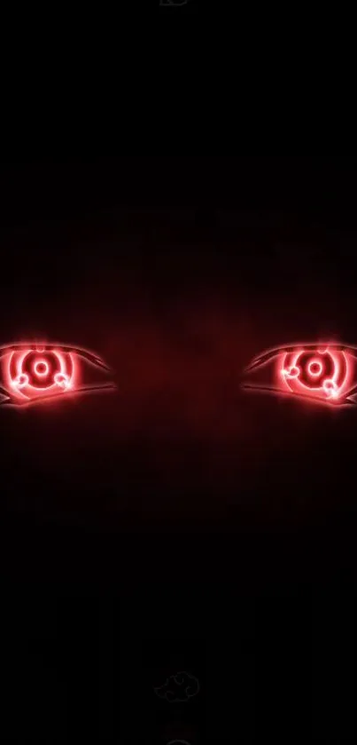 Neon red eyes glowing on a dark, black background wallpaper.