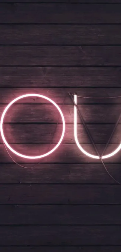 Neon letters on dark wooden background, creating a modern aesthetic.