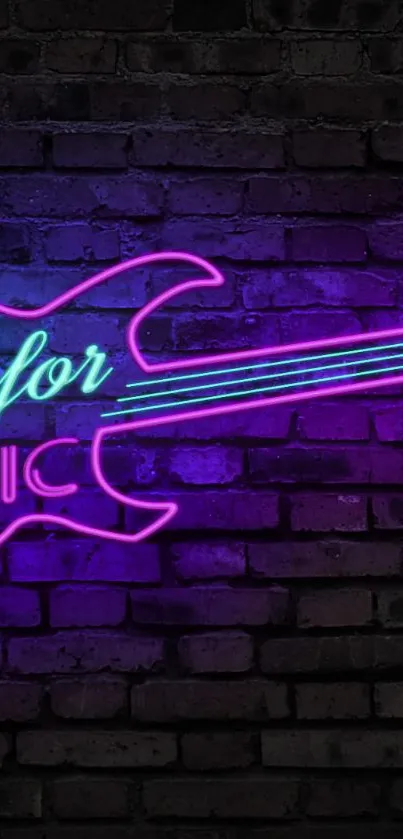 Neon pink guitar sign on a brick wall background.