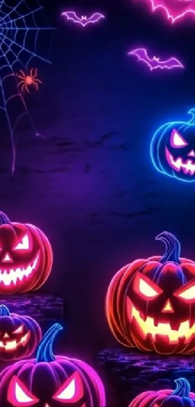 Neon Halloween pumpkins with glowing faces.