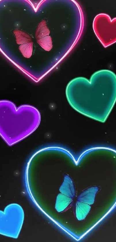 Neon hearts with colorful butterflies on a black background.