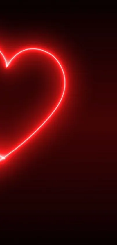 Vibrant red neon heart on a dark background.