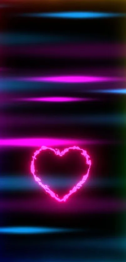 Vibrant neon heart with colorful frame glowing against a black background.