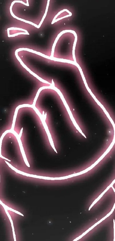 Neon pink hand gesture with heart on a black background.