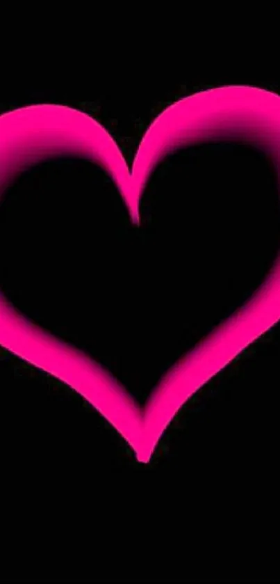 Neon pink heart glowing on a black background wallpaper.