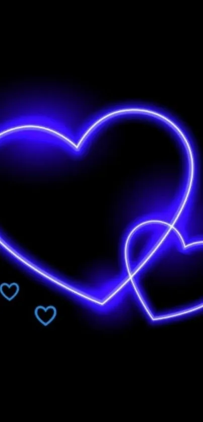 Neon heart design glowing on blue and black background wallpaper.