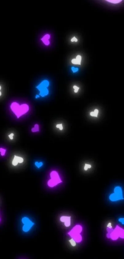 Vibrant neon heart pattern on black background.