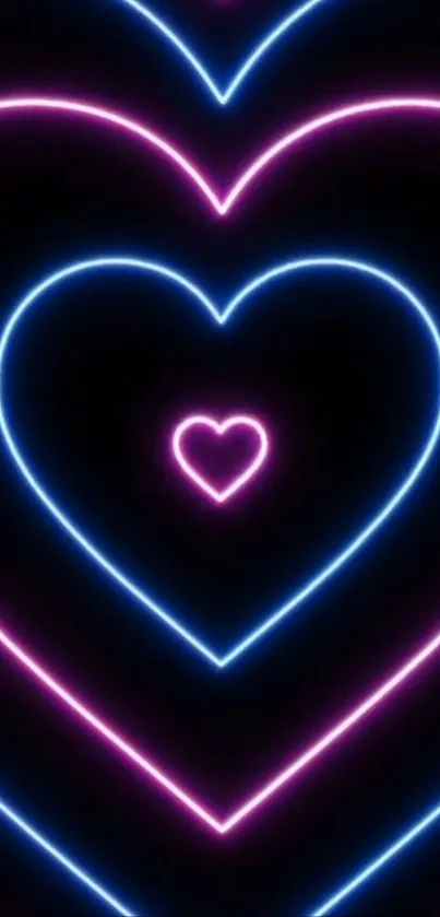 Neon heart wallpaper with pink and blue light pattern.