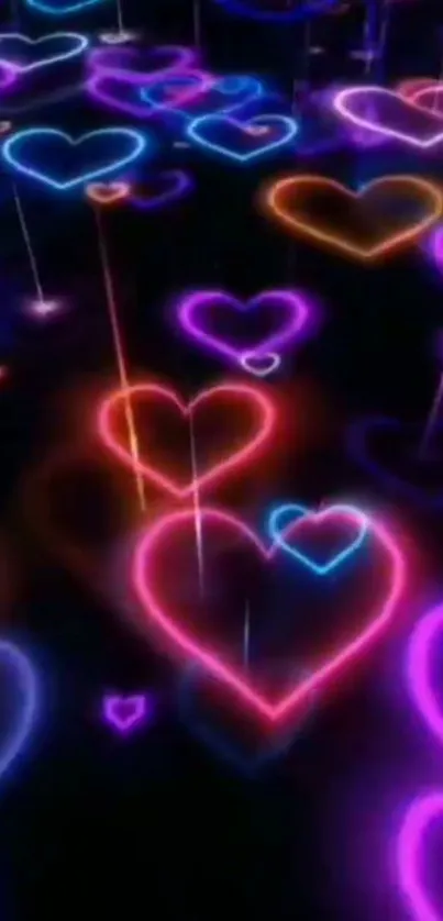 Neon heart wallpaper with vibrant glowing colors on a dark background.