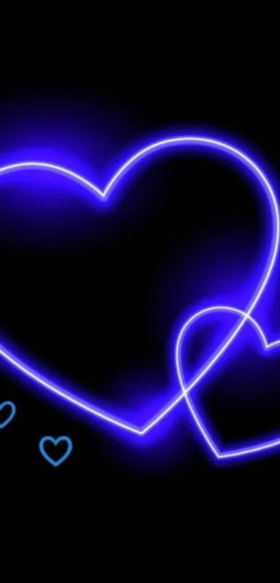 Glowing neon blue heart on dark wallpaper.