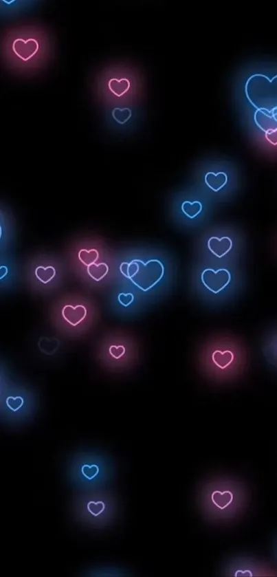 Vibrant neon heart design on black wallpaper background.