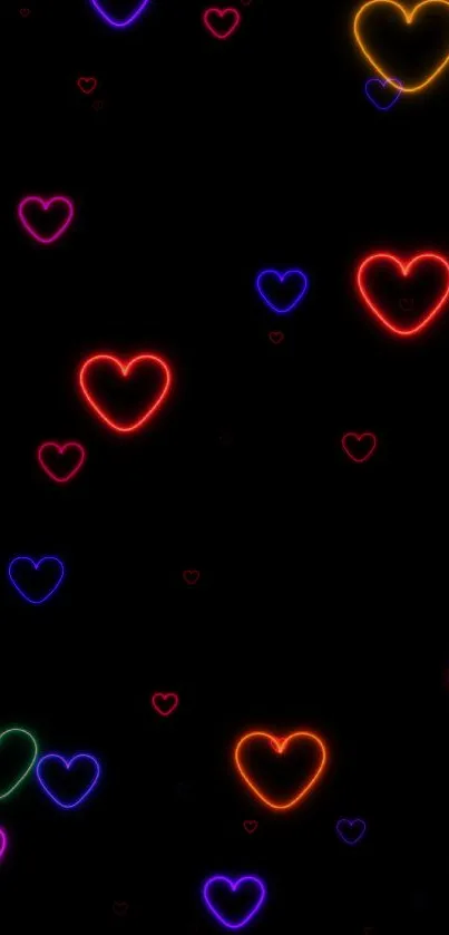 Neon hearts glowing on a black background wallpaper.