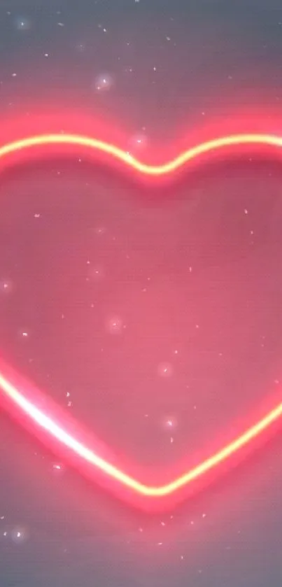 Neon pink heart glowing on dark background.