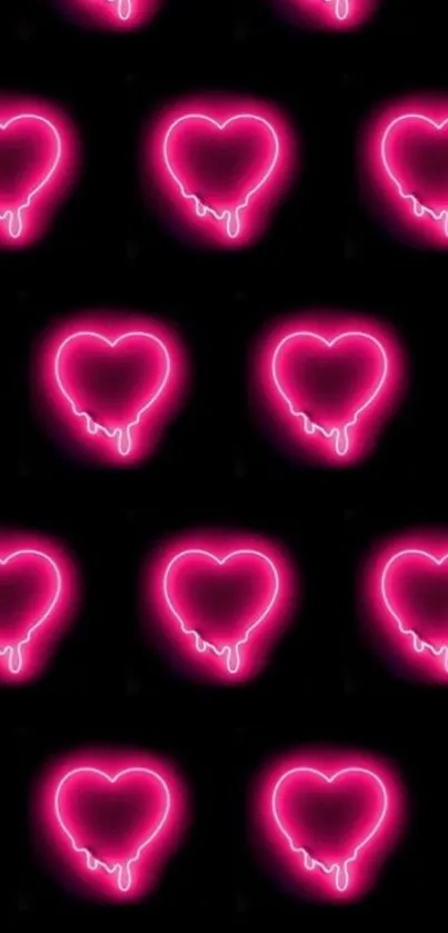 Neon pink hearts pattern on a black background.