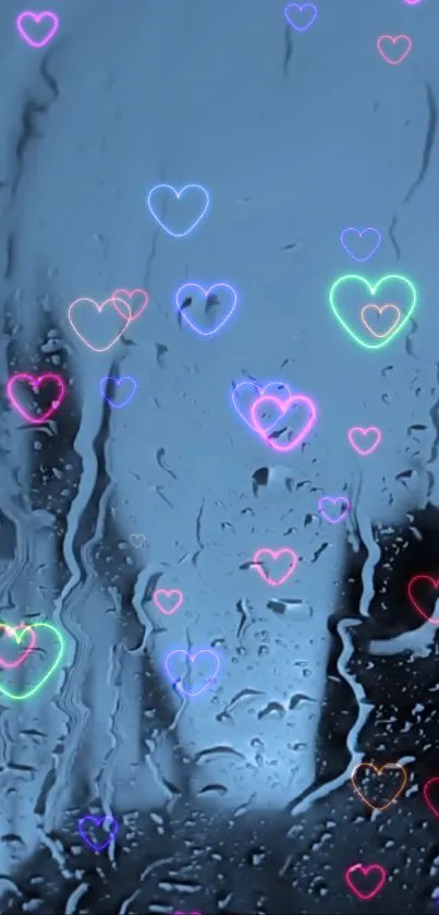 Neon hearts on a wet glass background in blue hues.