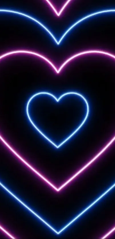 Neon heart wallpaper with vibrant pink and blue glow on a black background.