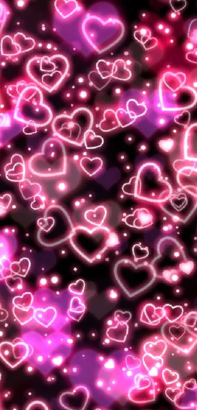 Vibrant neon hearts on a dark background wallpaper.