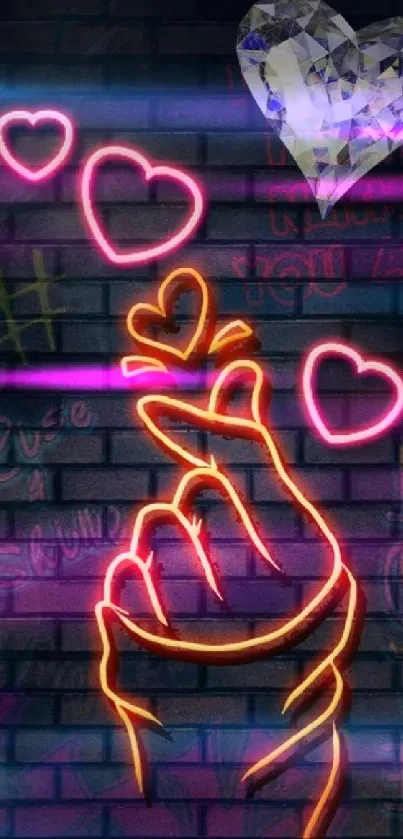 Neon finger heart with glowing hearts on a dark urban wall.