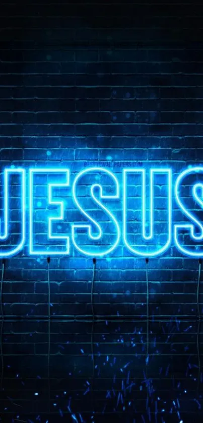 Neon blue Jesus sign on a brick wall background.