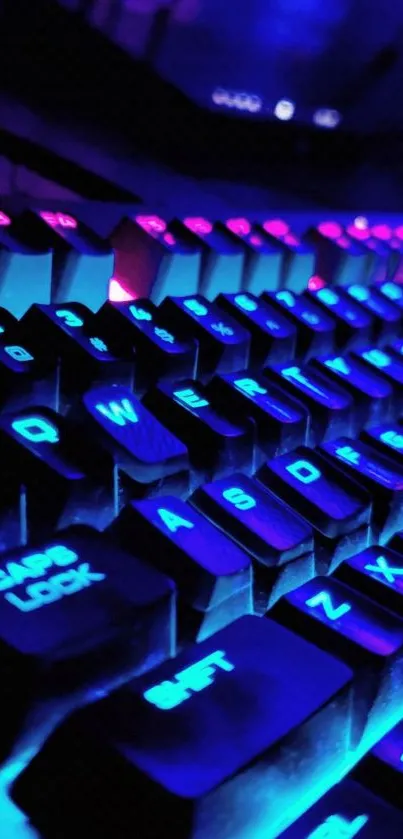 Neon-lit keyboard with glowing blue and pink keys creating a vibrant tech ambiance.