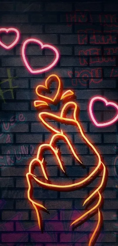 Neon hand with hearts on graffiti wall.