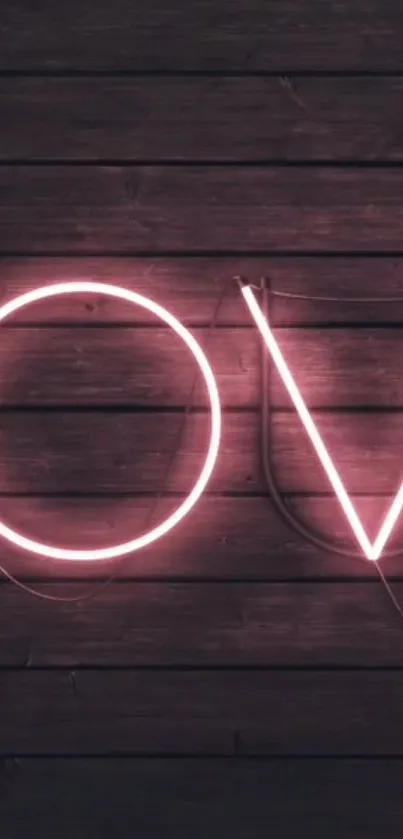 Neon love letters on dark wooden backdrop