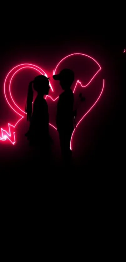 Silhouette of couple with neon heart in background.