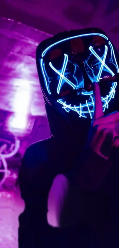 A person wearing a neon LED mask with graffiti background.