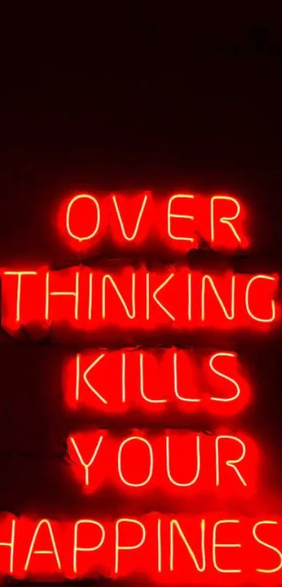 Red neon text reading 'Overthinking kills your happiness' on a dark background.