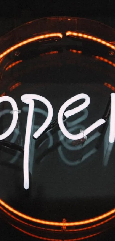 Neon open sign with glowing circle on dark background.