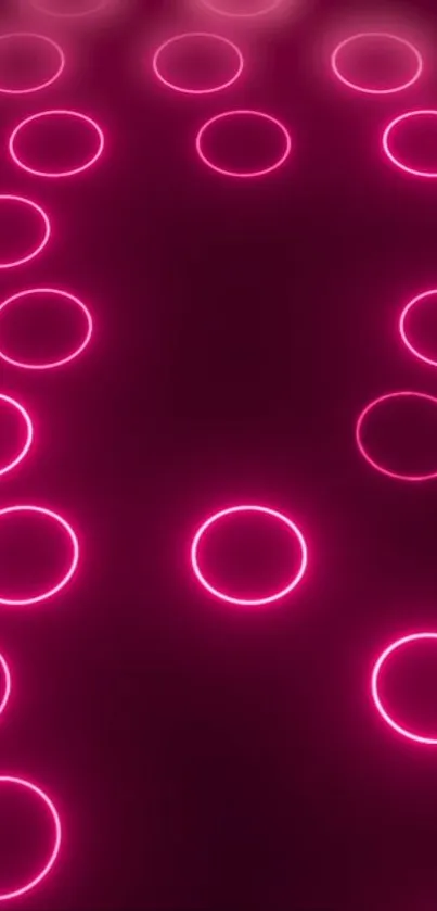 Neon pink circle pattern on dark background.