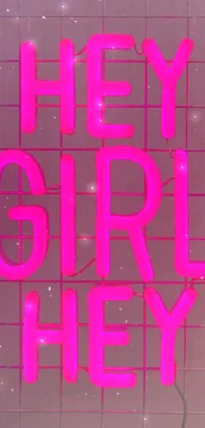 Neon pink 'Hey Girl Hey' text on tiled wall.