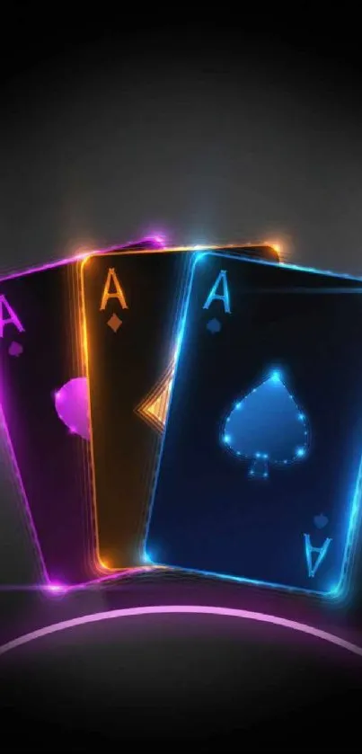 Neon playing cards with glowing aces on a black background.