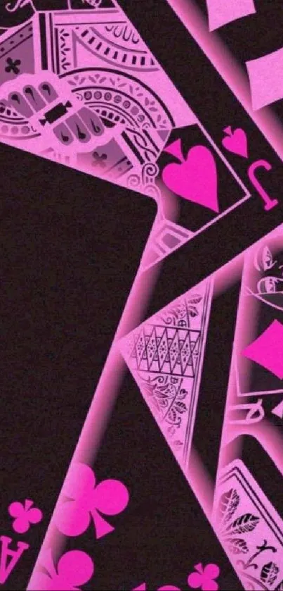 Neon pink playing cards with stylish design on a black background.