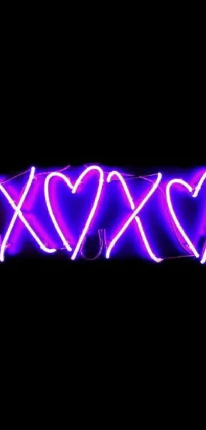 Neon purple XOXO heart design on black background wallpaper.