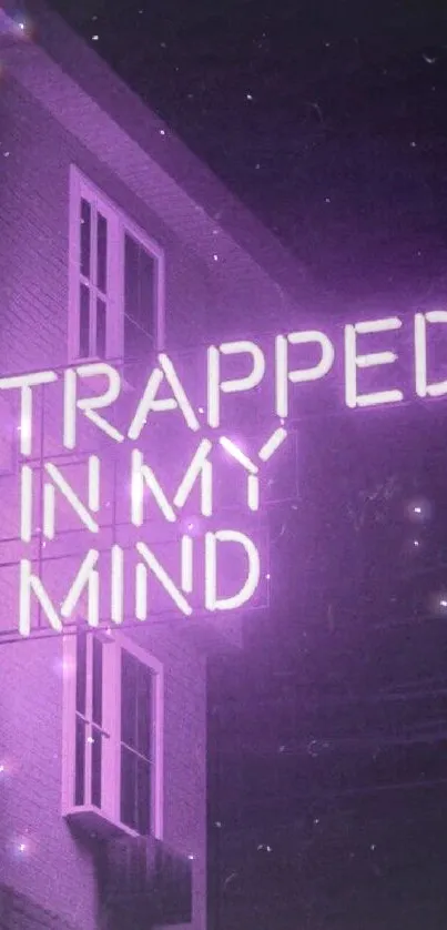 Neon purple sign reading 'Trapped in my mind' on a building wall.