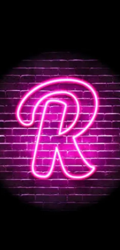 Neon letter R on a purple brick wall wallpaper.