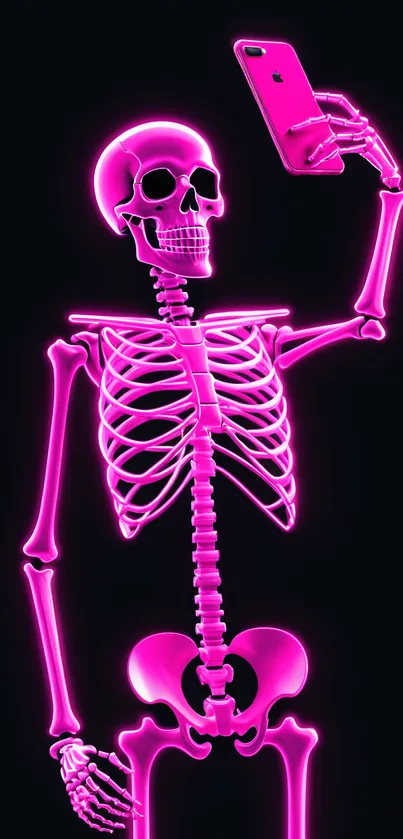 Neon pink skeleton taking a selfie against a dark background.