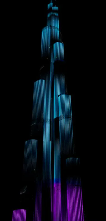 Neon-lit skyscraper against a dark sky, showcasing vibrant colors and modern design.