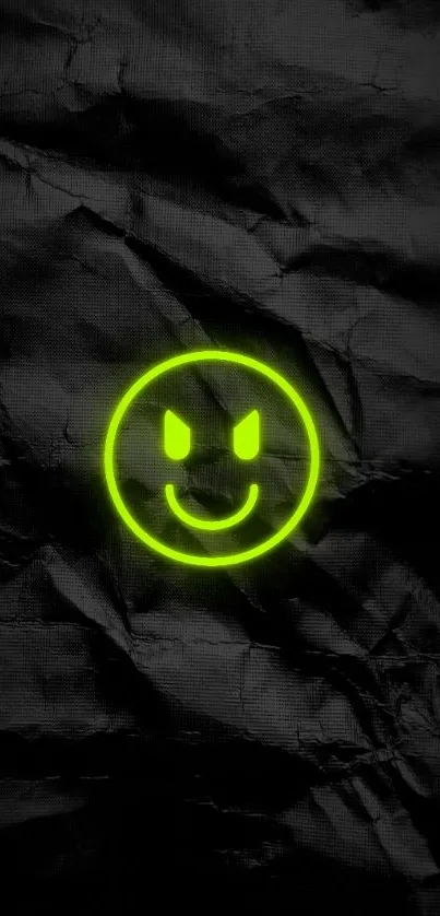 Neon smiley face on grunge black background.