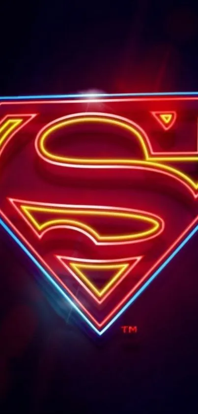 Bright neon Superman logo on dark background with red and blue hues.