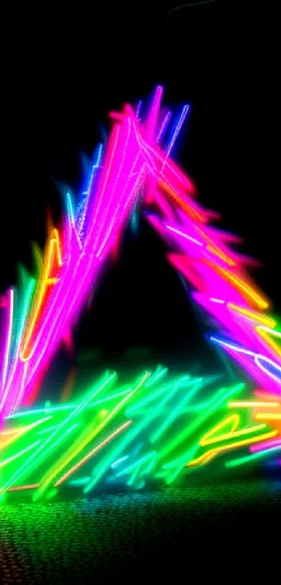 Vibrant neon triangle with colorful light streaks on a black background.