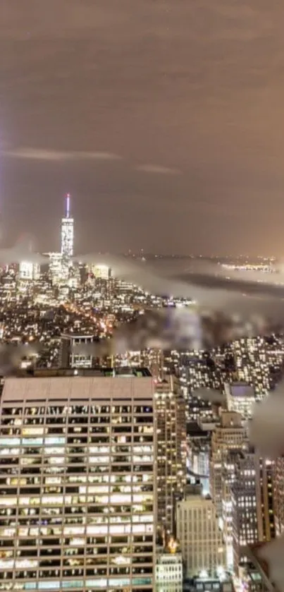 New York City skyline at night with illuminated skyscrapers and city lights.