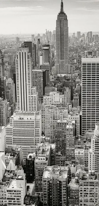 Black and white photo of New York City skyline featuring Empire State Building.