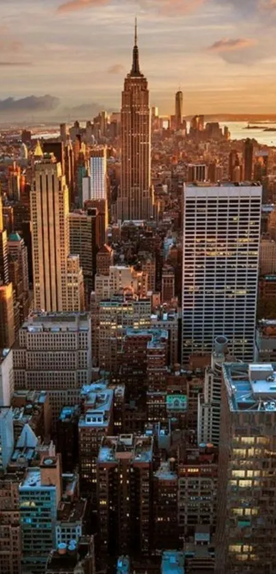 New York City skyline at sunset with illuminated buildings and a vibrant sky.