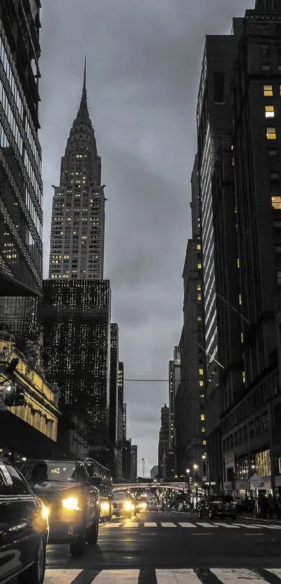 New York City skyscraper street at night with glowing lights.